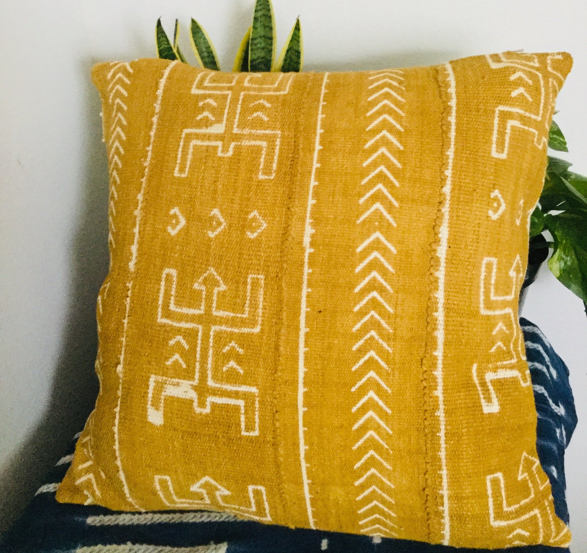 Kanaga On Mustard Mudcloth Fabric.